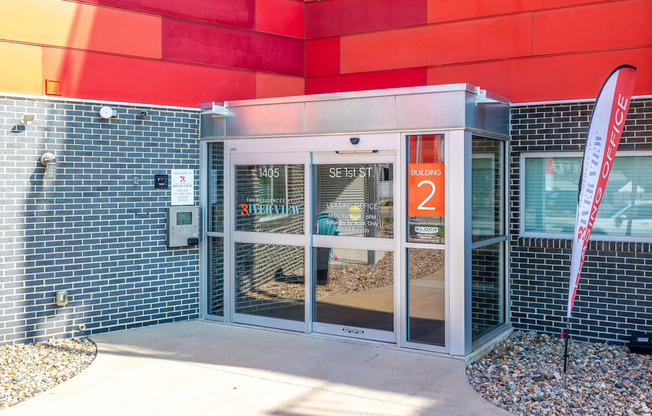 the entrance to a building with glass doors and a sign that reads station 2