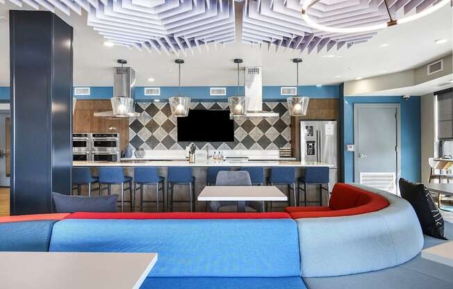A modern kitchen with a blue and white color scheme.