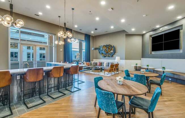 A modern dining area with a wooden table surrounded by chairs.