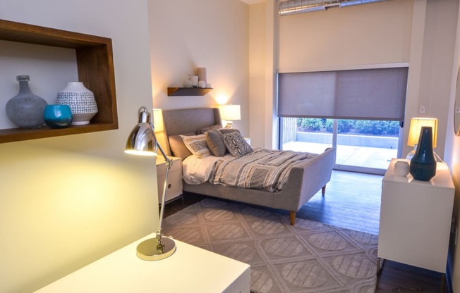 a bedroom with a bed and a window