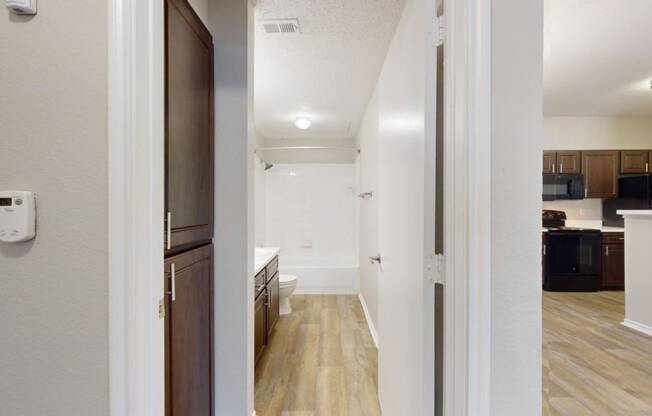 a view of a kitchen and living room from a doorway