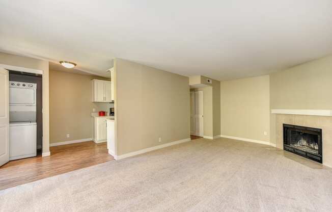 Vacant Kelsey and Mercer Floorplan Living and Dining Area with Fireplace & Stackable W/D Closet in Select Homes 