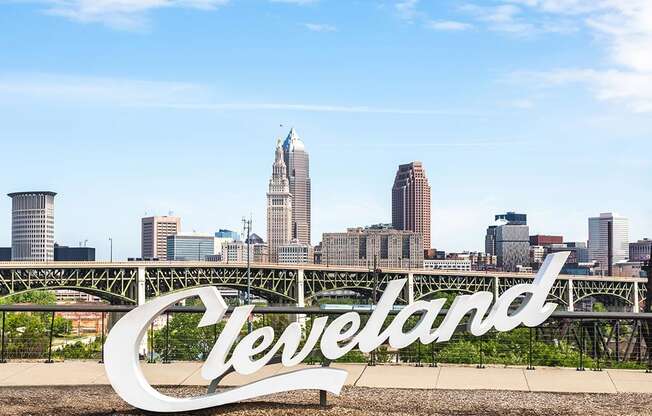 Iconic Cleveland sign with Cleveland skyline in the background. 