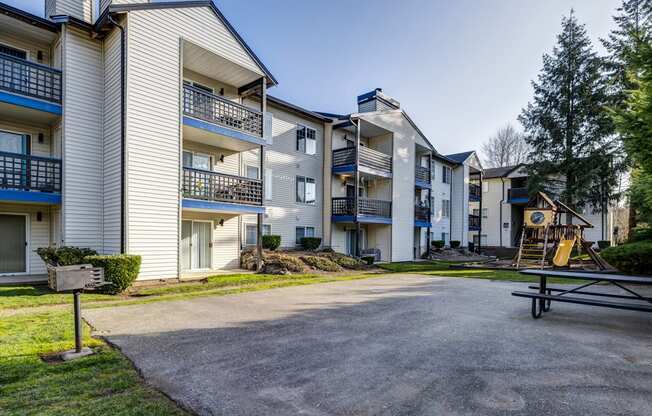 2 BR Apartments in Everett Washington - Woodbrook - BBQ Area with Grill, Picnic Table, and Playground