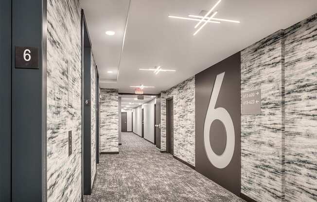 a hallway with a large number on the wall in a office