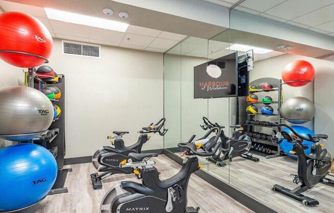 a room filled with lots of different types of exercise equipment