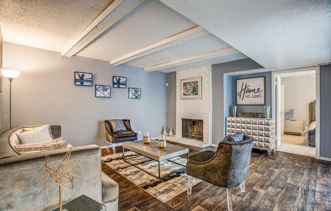 a living room with a fireplace and blue walls