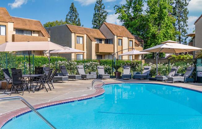 a house with a pool outside of a building