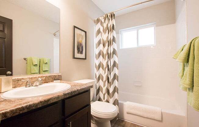 Relax in your bathroom with large soaking tub and shower at Artesian East Village, Atlanta, GA 30316