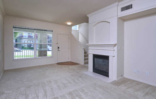 Carpeted Living Room with Fireplace