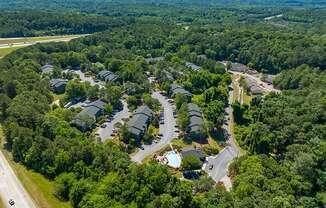 Aerial View Of The Halston Apartment Community With Pool