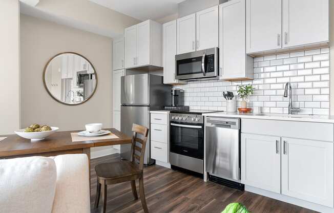 a kitchen and dining area in a 555 waverly unit