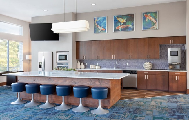 clubhouse kitchen with a large island and blue stools
