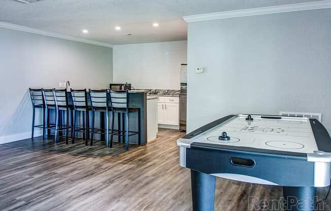 The Commons Apartments in Tampa Florida photo of clubhouse with air hockey table