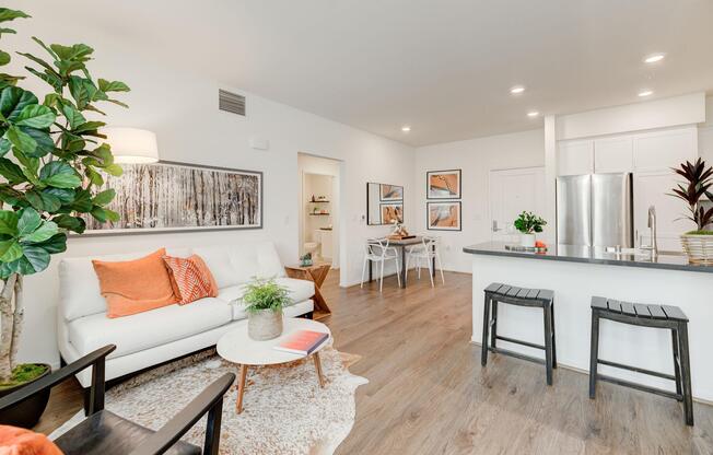 a living room filled with furniture and a flat screen tv