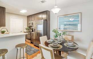 a kitchen and dining room with a table and chairs at Reserve of Jackson Apartment Homes, Mississippi, 39211