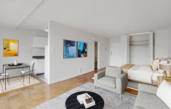 A living room with a grey couch and a coffee table.