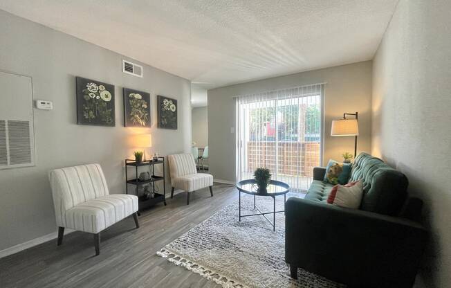 a living room with a couch and two chairs  at 2151 Kirkwood, Houston, TX, 77077