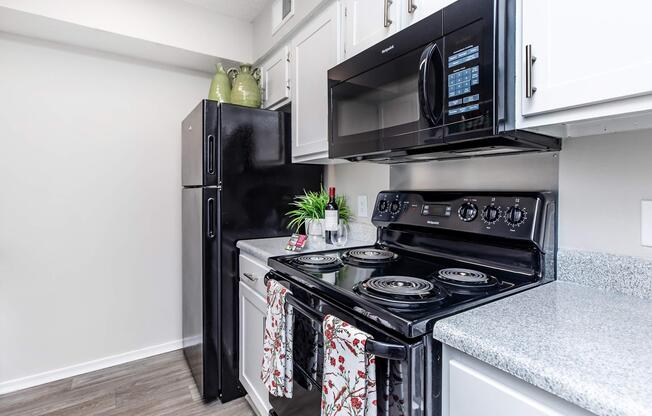 a stove top oven sitting inside of a kitchen