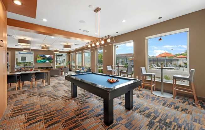 a resident clubhouse with a pool table and ping pong table