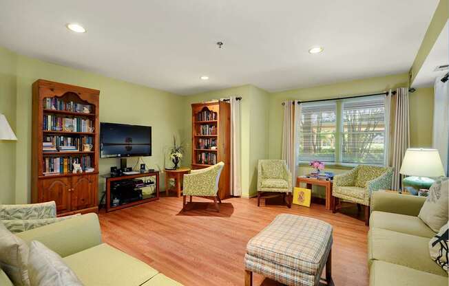 a living room filled with furniture and a tv