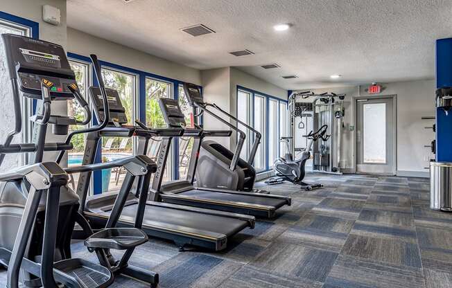 the gym with cardio equipment at the monarch luxury apartments in midtown