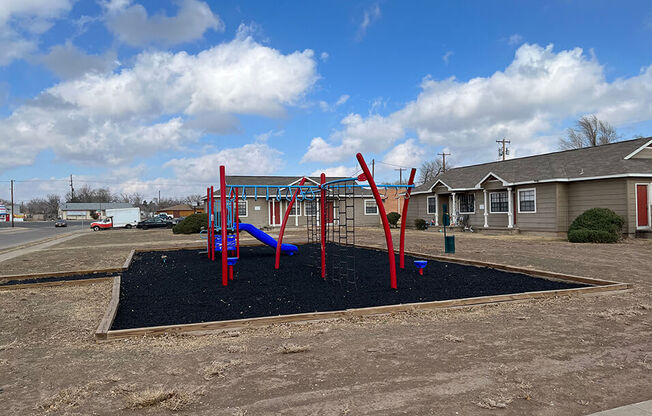 a picture of a playground with a blue sky in the background