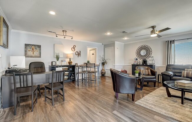 a living room and dining room with hardwood floors