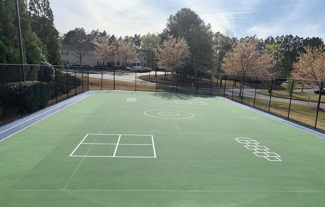 a tennis court with a soccer field on it
