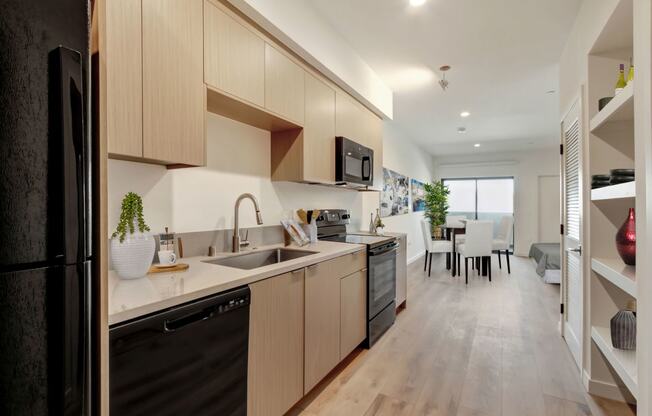 a kitchen and dining area in a 555 waverly unit