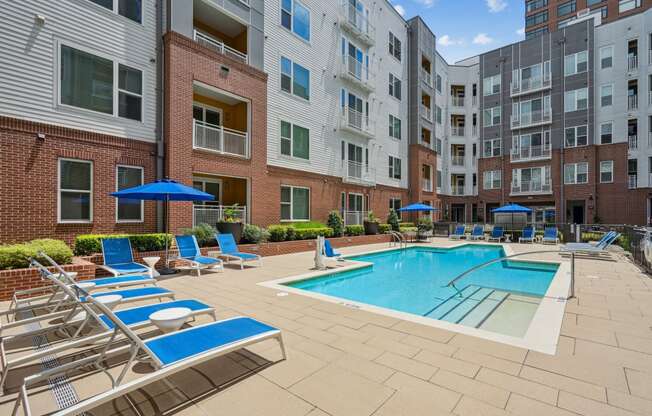 our apartments offer a swimming pool with chairs and umbrellas