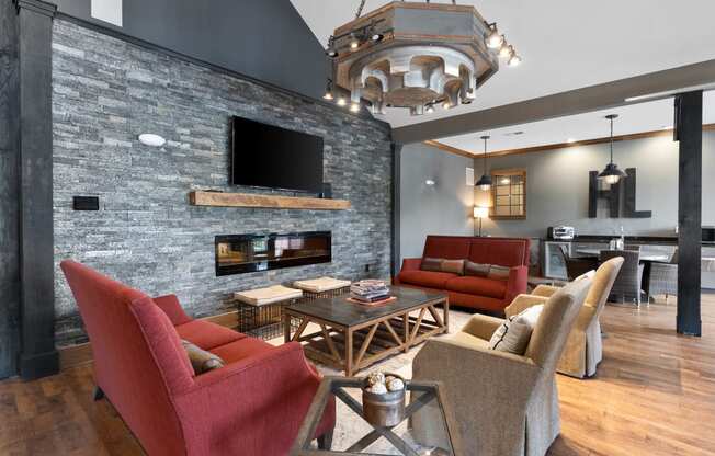 a living room with couches and chairs and a fireplace at Hayden Lofts, Dublin