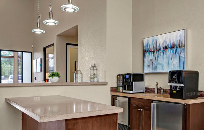 a kitchen with a counter top and a microwave