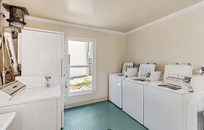 A laundry room with a washer and dryer in it.
