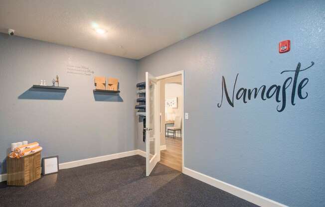 a room with a blue wall with a name on it