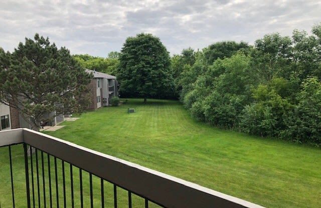 Balcony Backyard View at Three Oaks Apartments in Troy, 48098