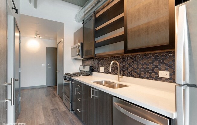 a kitchen with a sink and a refrigerator