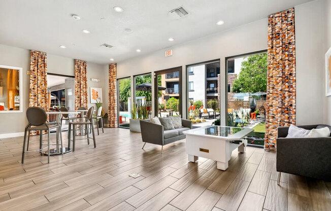 Community Clubhouse with Game Tables at Harmony at Surprise Apartments in Surprise, AZ.