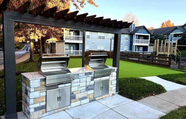 a grilling area in the middle of a sidewalk