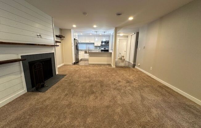 BEAUTIFULLY RENOVATED TOP FLOOR TOWNHOME CONDO WITH COVERED PARKING