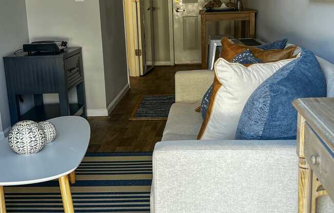 a living room with a couch and a table