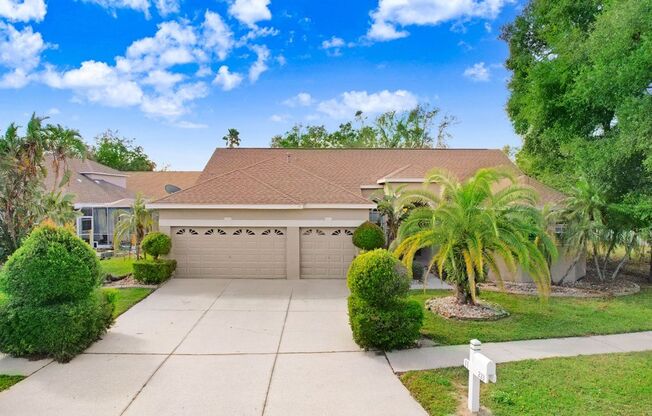 Beautiful 4/3 Split Floor Plan Home with Pool, 3-Car Garage & New Flooring!