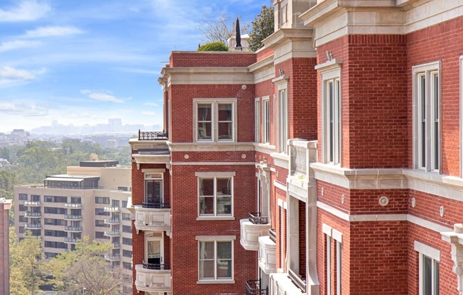 a red brick building with a city in the background