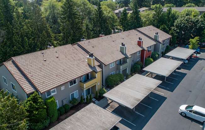 an aerial view of a building with a parking lot and trees at Quartz Creek, Washington