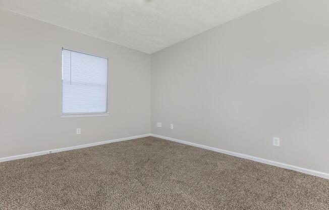 a bedroom with a large mirror