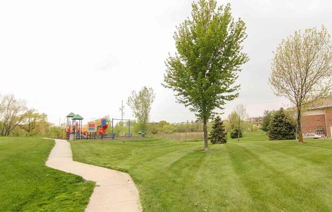 Walking trails and playground at the Northbrook Apartment Homes in Lincoln NE