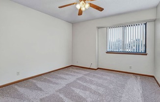 apartment bedroom with ceiling fan