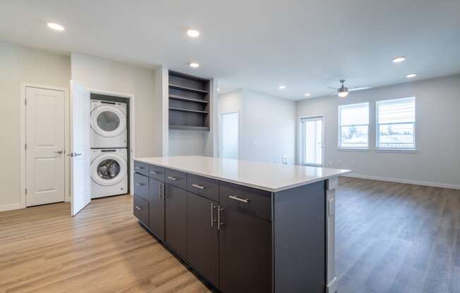 a laundry room with a washer and dryer in a new home