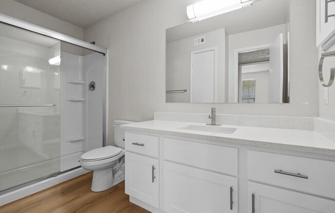 a bathroom with a sink toilet and a shower at Highland Park Apartment Homes, Kansas, 66214