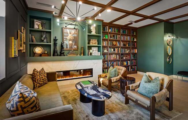 A living room with a fireplace, bookshelves, and a couch.